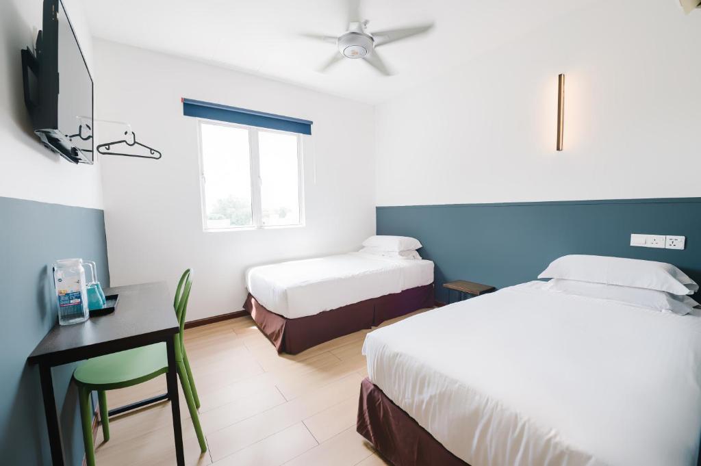 Postel nebo postele na pokoji v ubytování The Concept Hotel KL - Batu Caves
