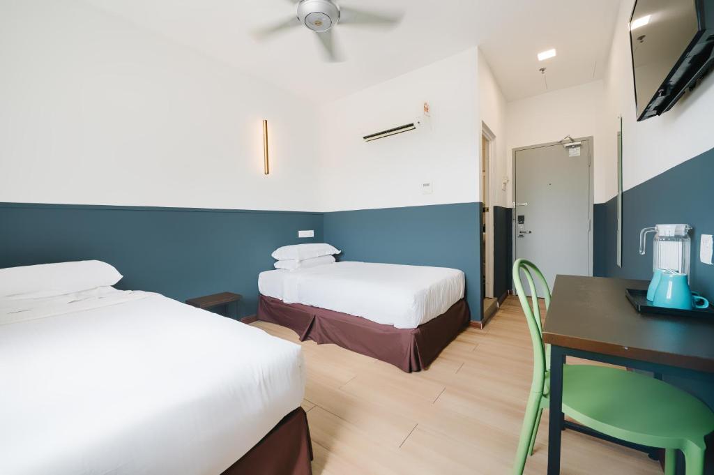 Postel nebo postele na pokoji v ubytování The Concept Hotel KL - Batu Caves