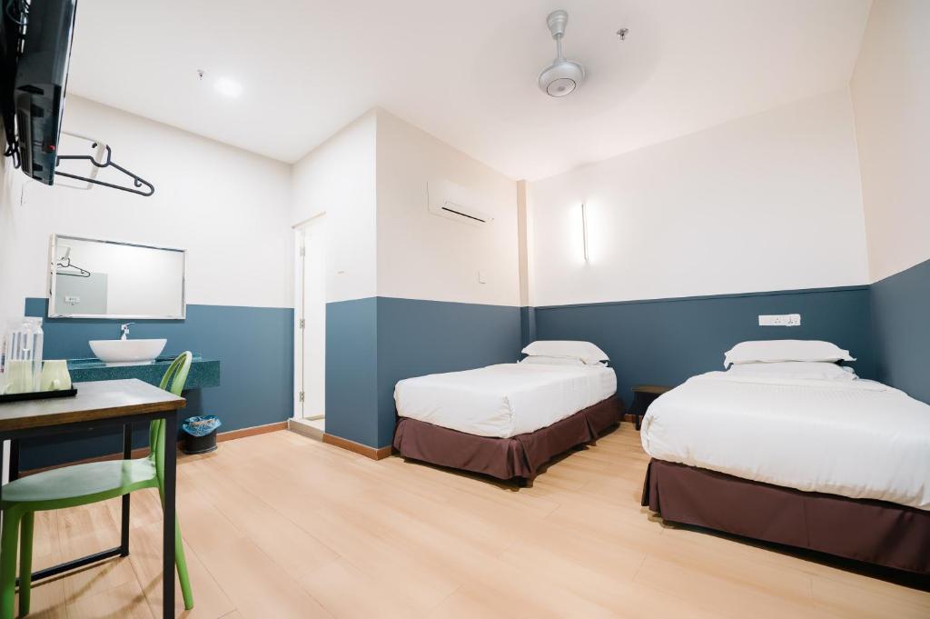 Postel nebo postele na pokoji v ubytování The Concept Hotel KL - Batu Caves
