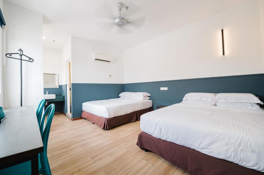 Postel nebo postele na pokoji v ubytování The Concept Hotel KL - Batu Caves