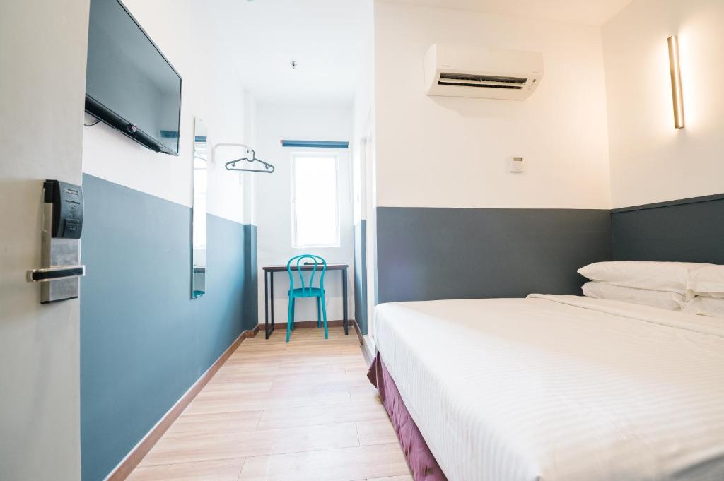 Postel nebo postele na pokoji v ubytování The Concept Hotel KL - Batu Caves