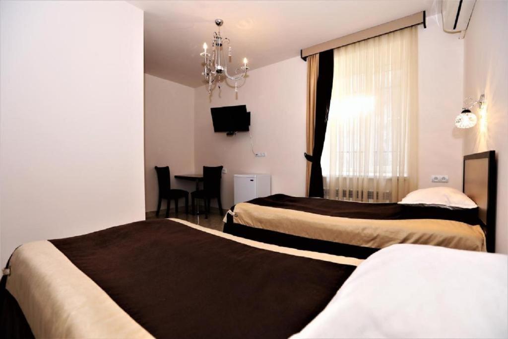 Postel nebo postele na pokoji v ubytování Comfort House Hotel