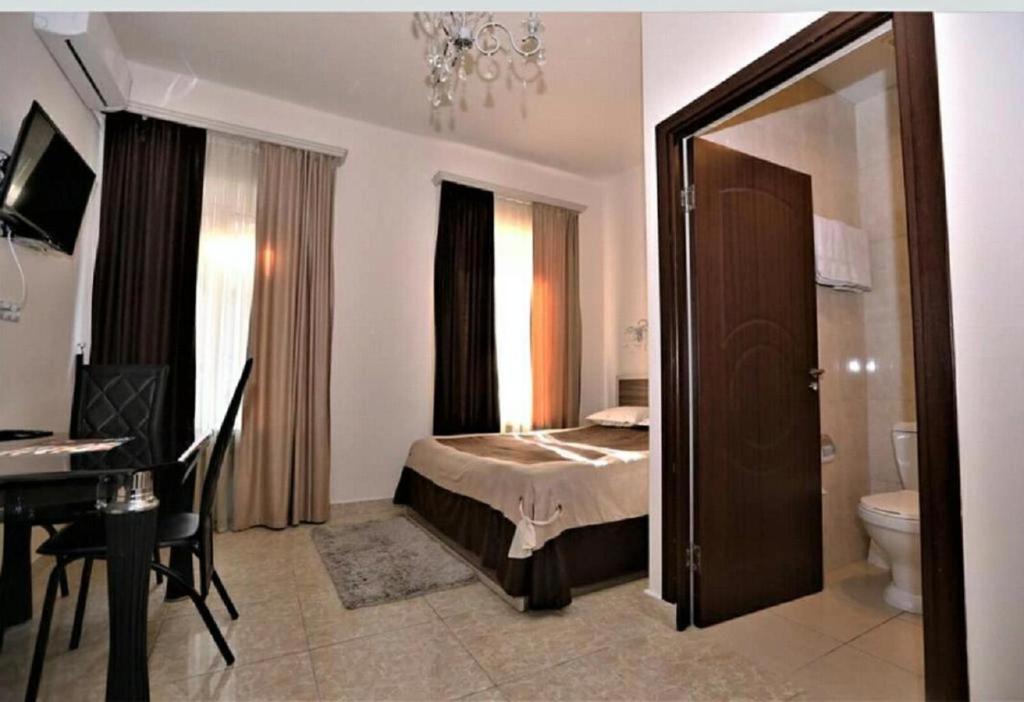 Postel nebo postele na pokoji v ubytování Comfort House Hotel