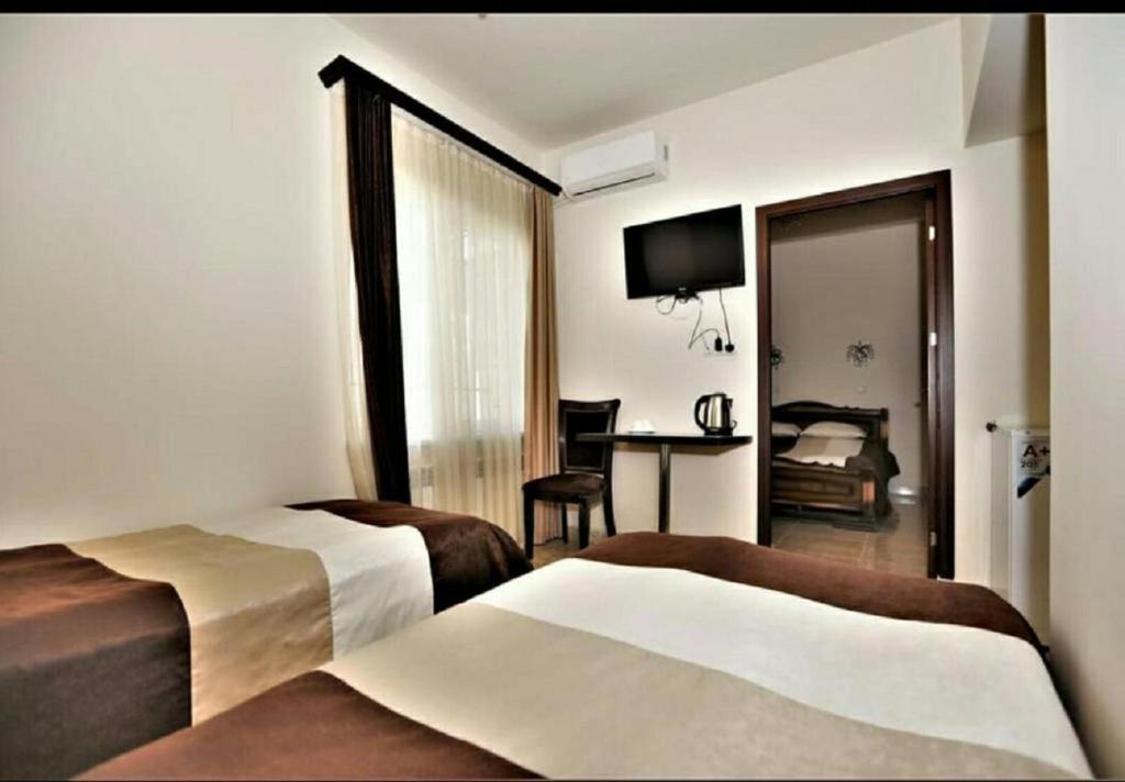 Postel nebo postele na pokoji v ubytování Comfort House Hotel