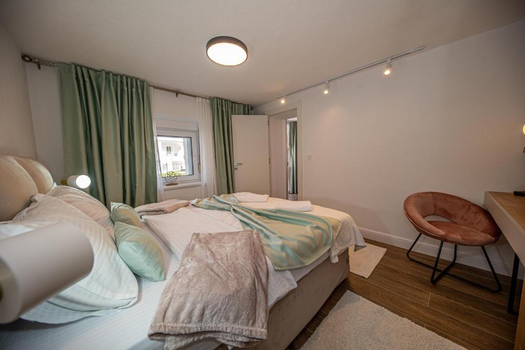 Postel nebo postele na pokoji v ubytování N&N Lux Guest house