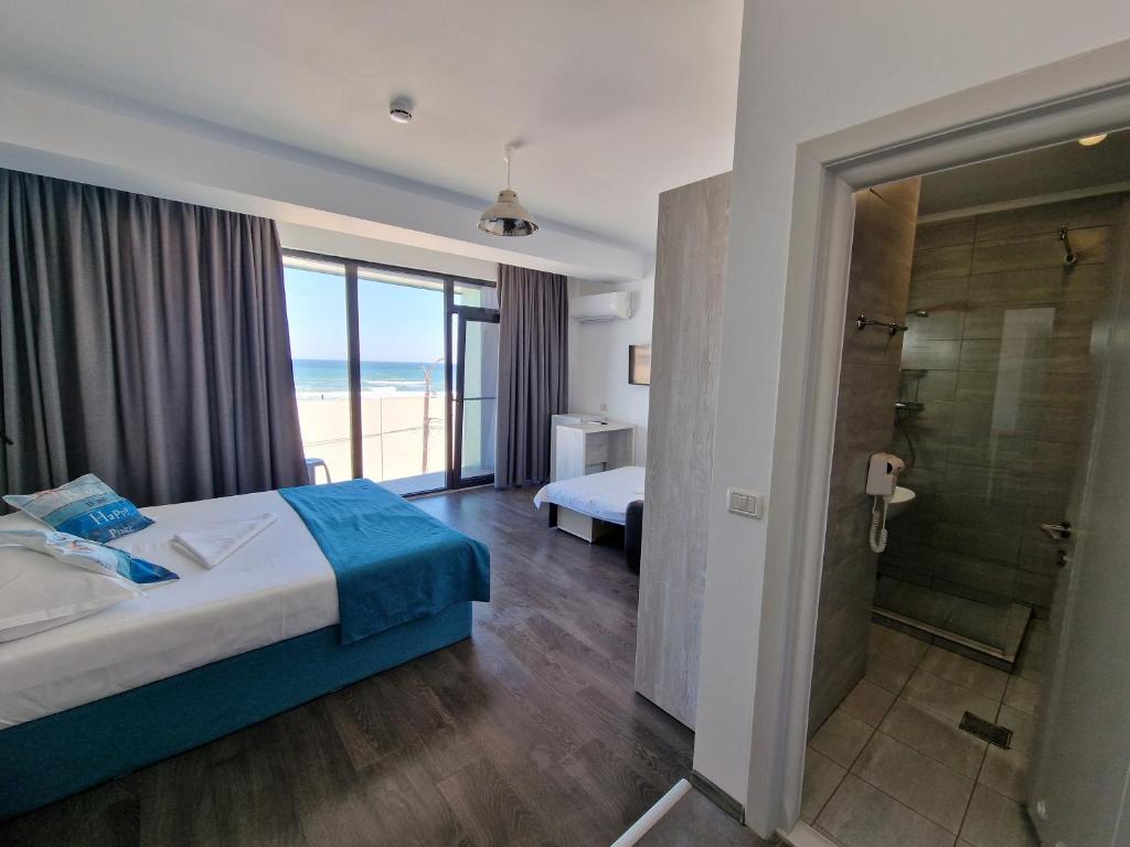Postel nebo postele na pokoji v ubytování Hotel H pe plaja Belona