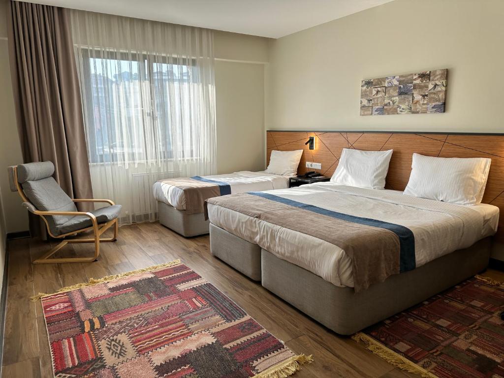 Postel nebo postele na pokoji v ubytování N'Ala Otel