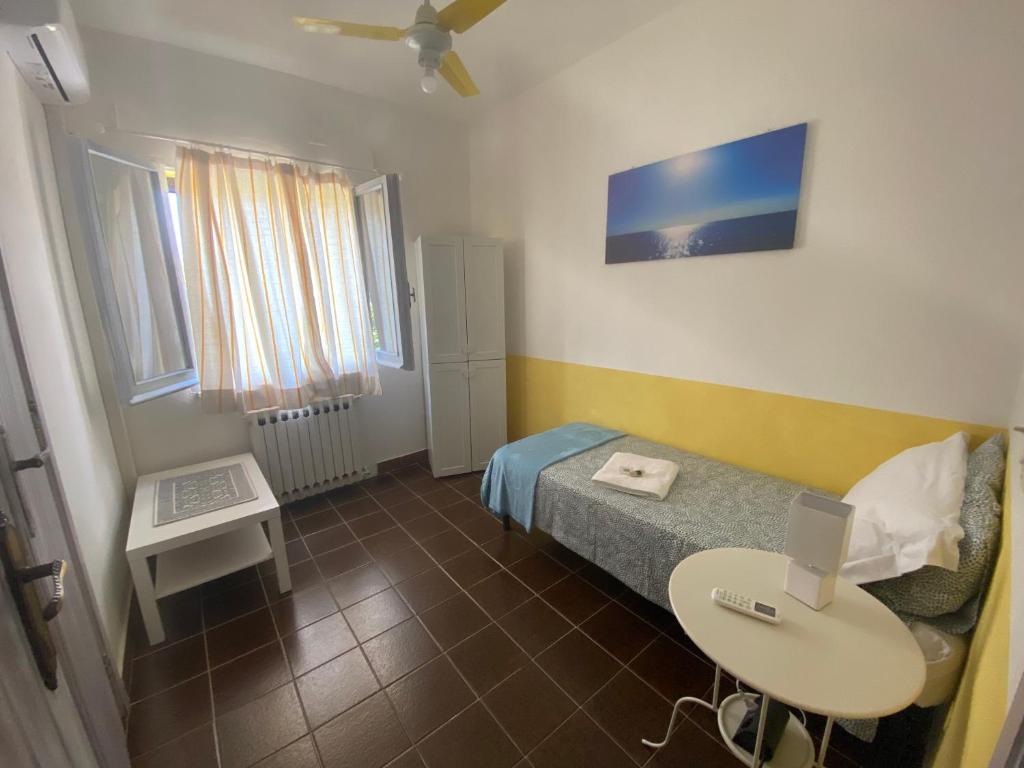 A bed or beds in a room at Alabe Hotel Marina di Tresnuraghes