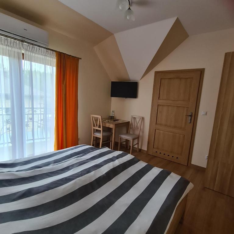 Postel nebo postele na pokoji v ubytování MARMI Noclegi