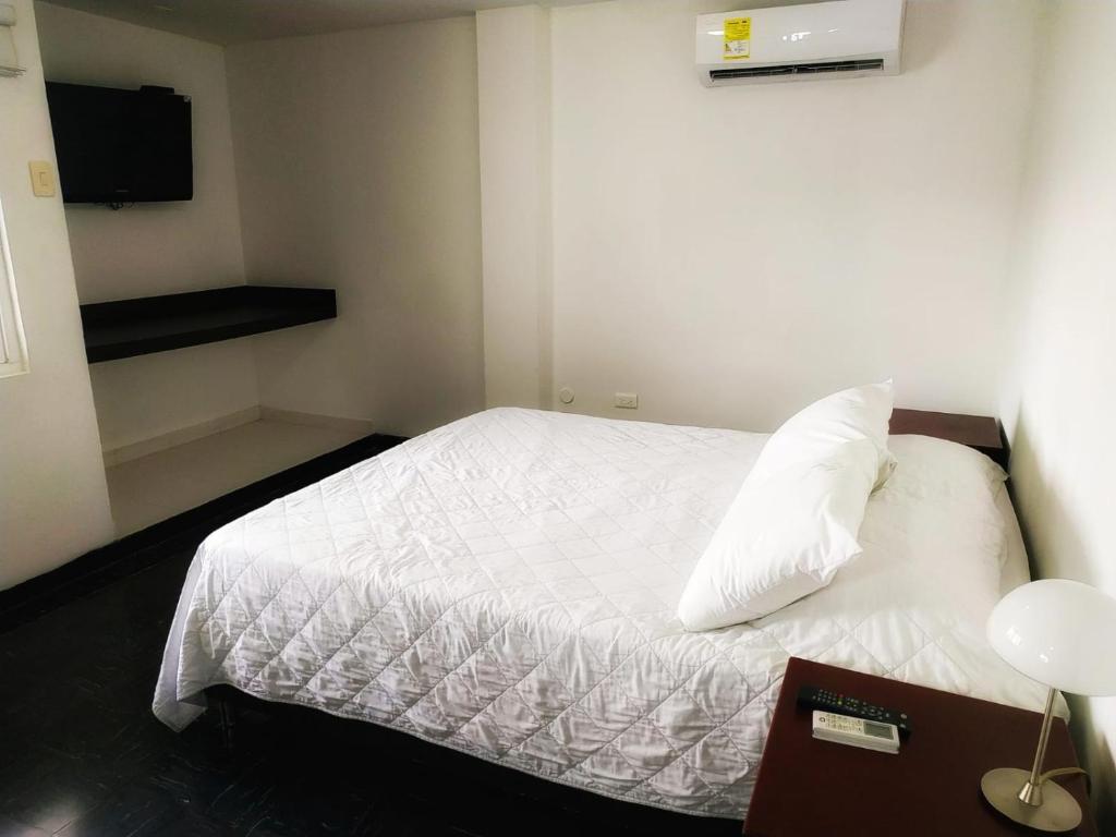Uma cama ou camas num quarto em Vallclaire Suites