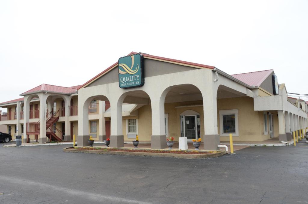 a hotel with a sign on the front of it at Quality Inn & Suites in Covington