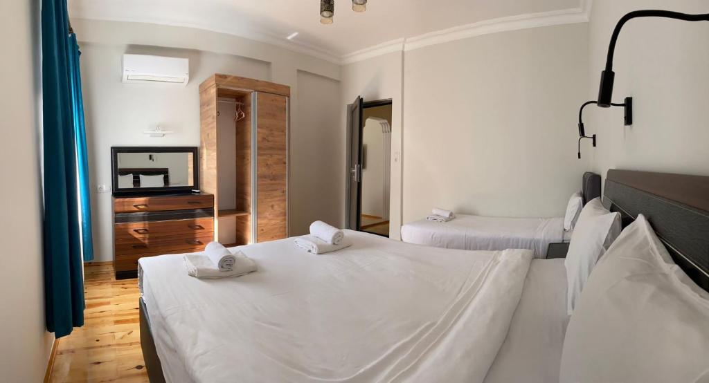 Postel nebo postele na pokoji v ubytování Palm Konak Hotel