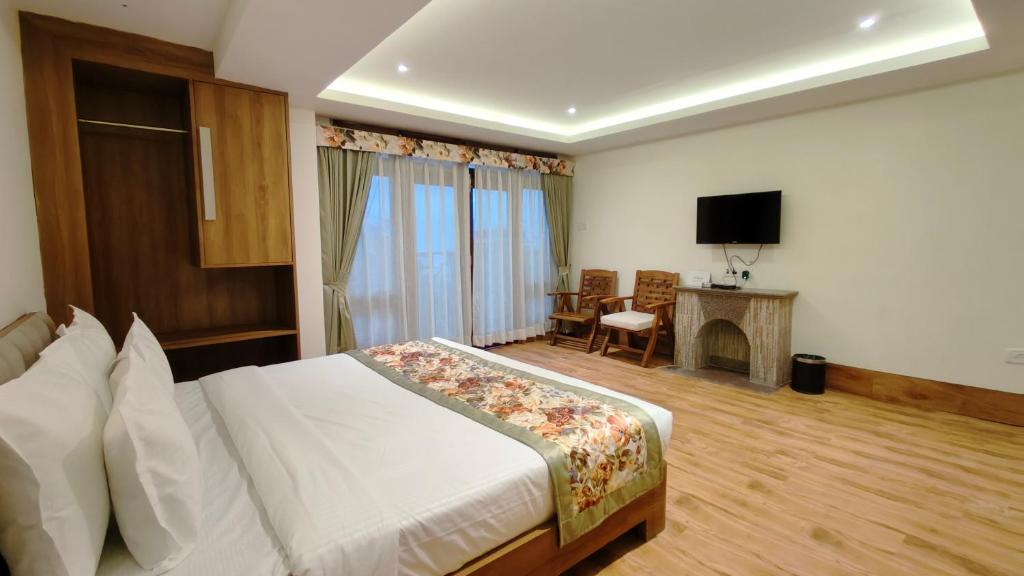 TV a/nebo společenská místnost v ubytování Mount Polaris Suites & Spa