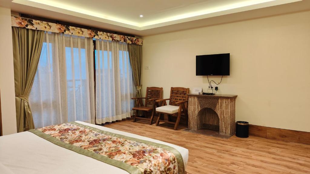 TV a/nebo společenská místnost v ubytování Mount Polaris Suites & Spa