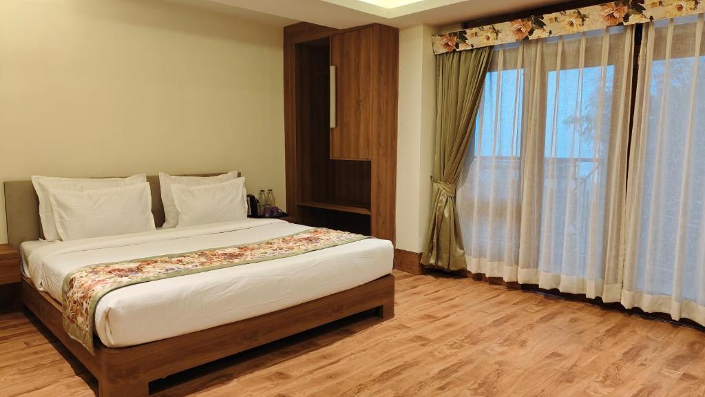 Postel nebo postele na pokoji v ubytování Mount Polaris Suites & Spa