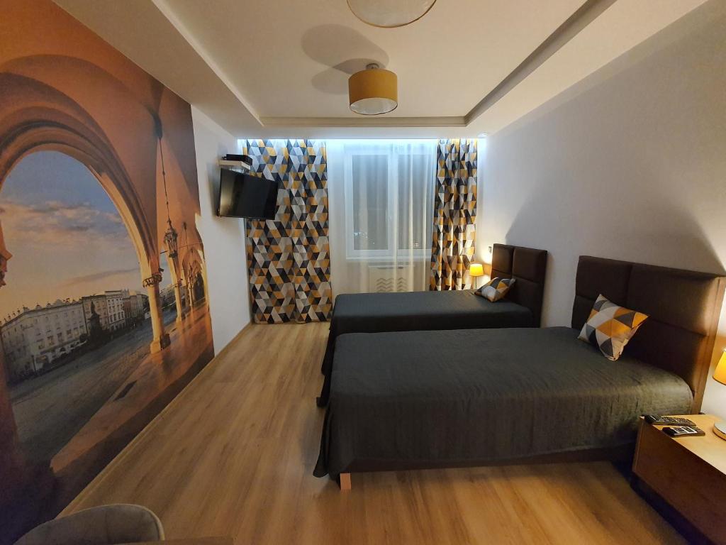 Un pat sau paturi într-o cameră la Komfortowo i cicho - Apartament