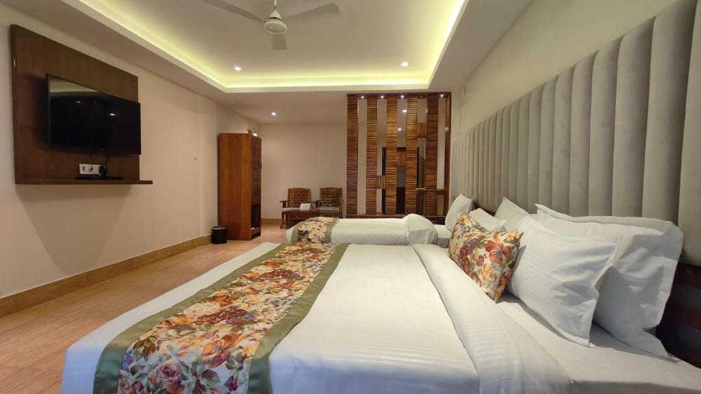 Postel nebo postele na pokoji v ubytování Mount Polaris Suites & Spa