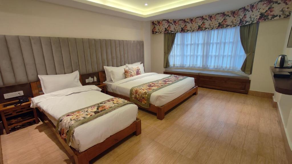 Postel nebo postele na pokoji v ubytování Mount Polaris Suites & Spa
