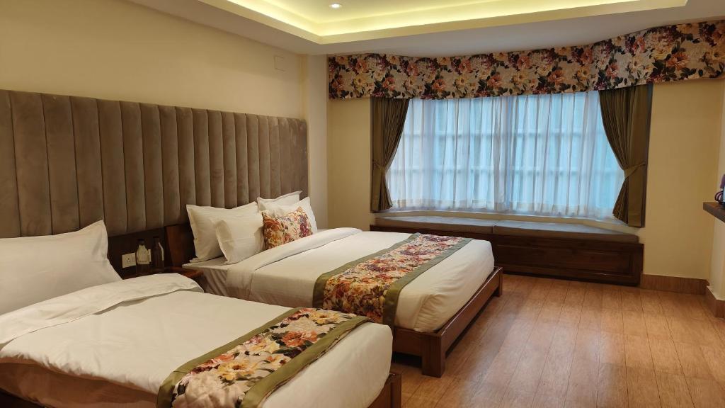 Postel nebo postele na pokoji v ubytování Mount Polaris Suites & Spa