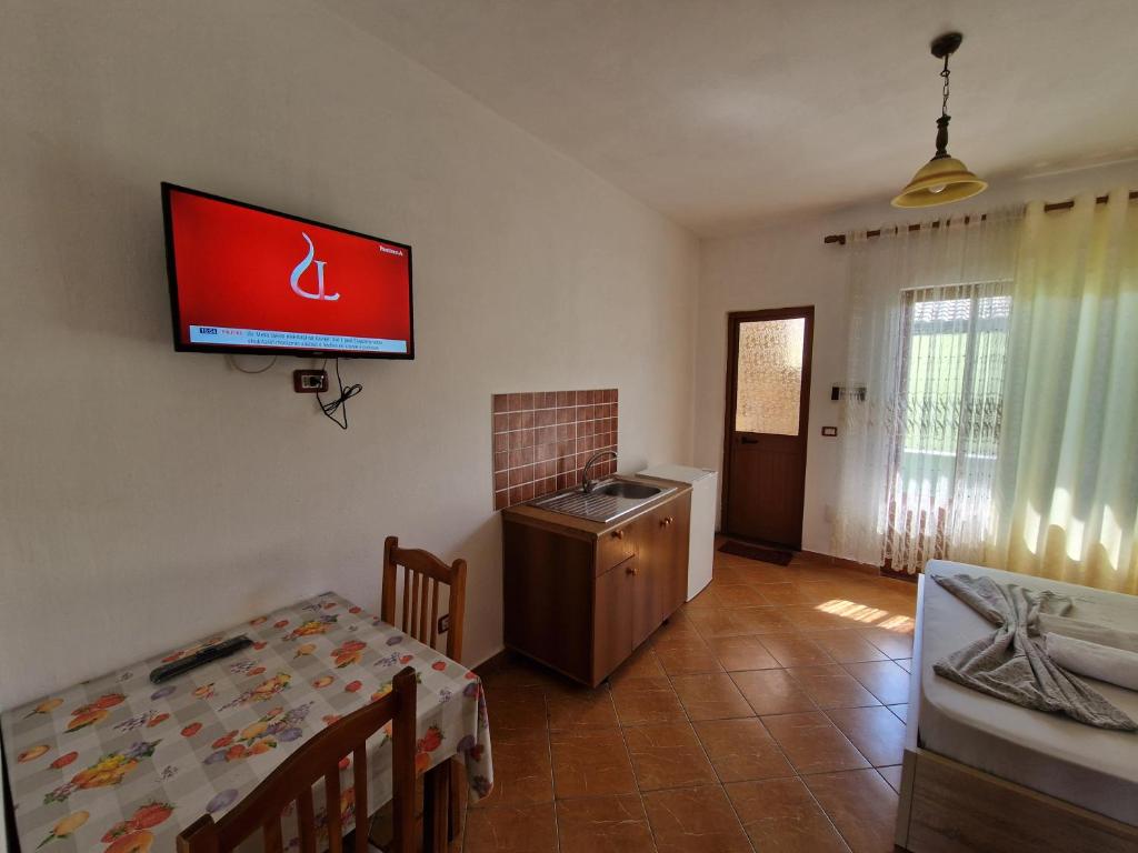 TV a/nebo společenská místnost v ubytování Guest House "Pisha"