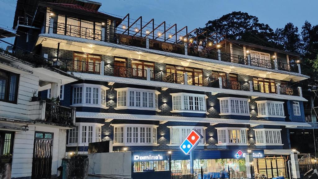 a large building with lights on the side of it at Mount Polaris Suites & Spa in Kalimpong