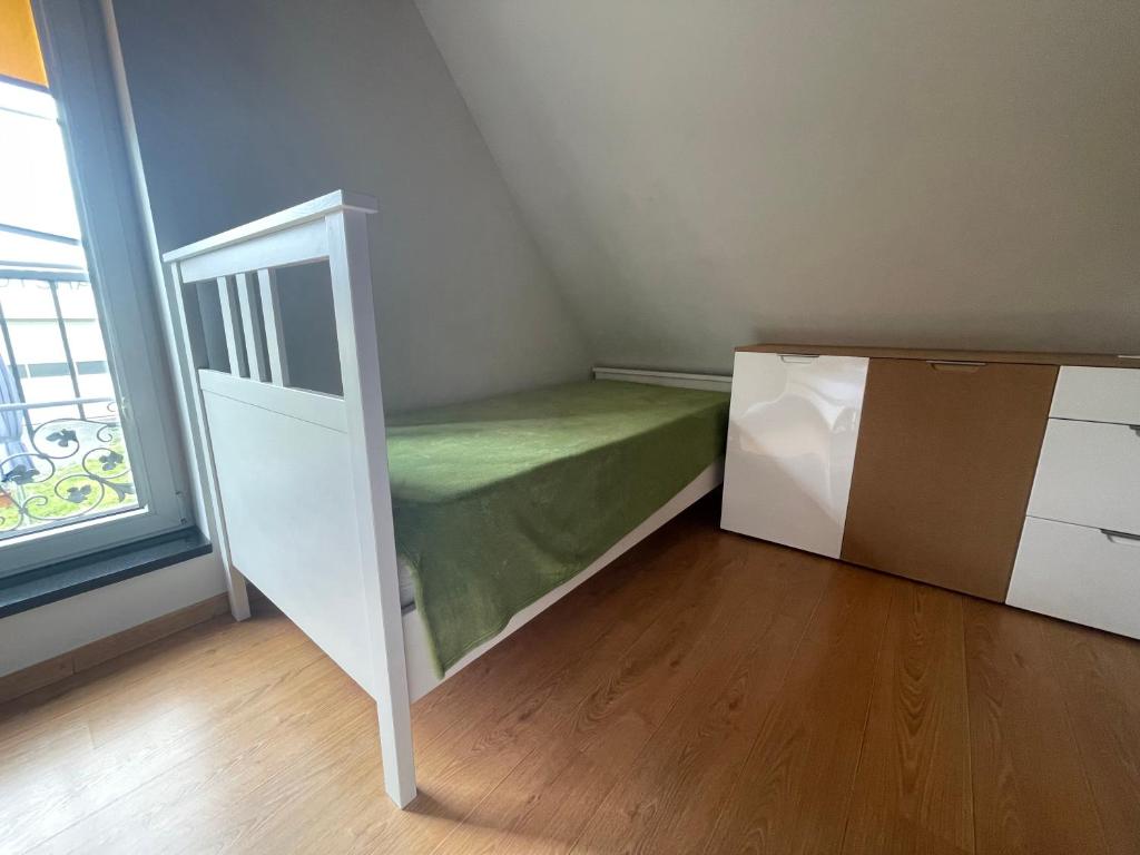 Postel nebo postele na pokoji v ubytování Ferienwohnungen am Cospudener See