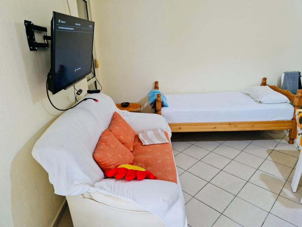 En eller flere senge i et værelse på Seaside Apartment 15