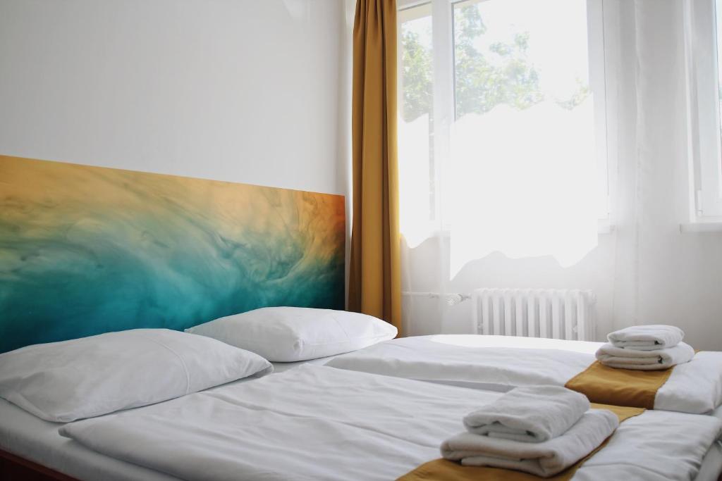 Postel nebo postele na pokoji v ubytování Hotel AMITY