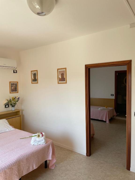 Postel nebo postele na pokoji v ubytování HOTEL LA PLAYA