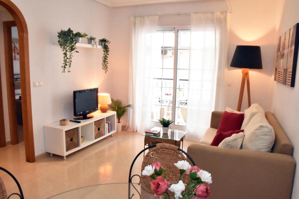 Μια τηλεόραση ή/και κέντρο ψυχαγωγίας στο Beach apartment Torrevieja