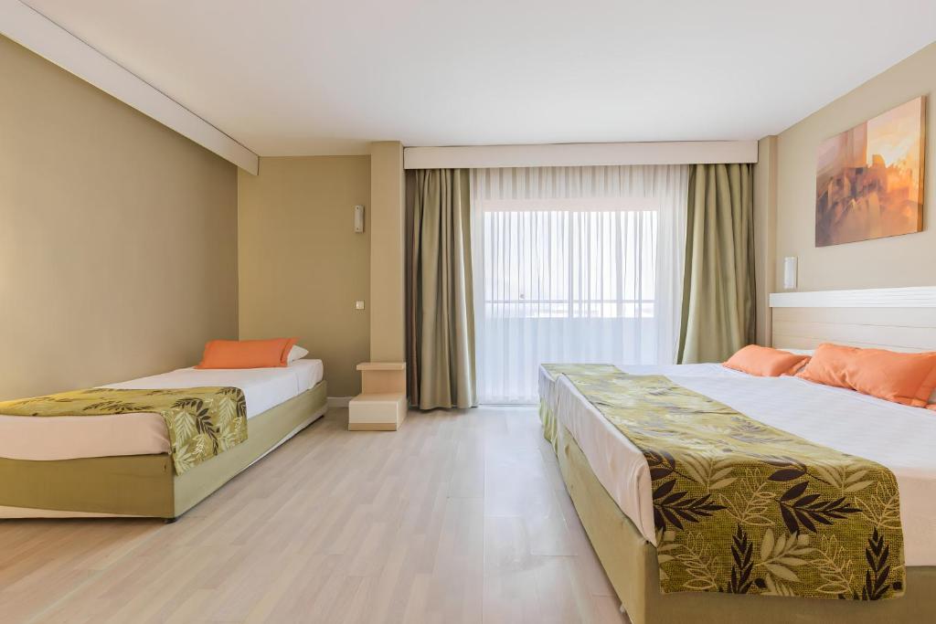 Postel nebo postele na pokoji v ubytování Akdora Elite Hotel & Spa