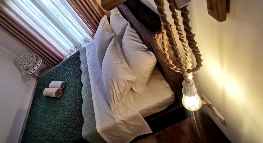 Postel nebo postele na pokoji v ubytování Giotouli Apartment
