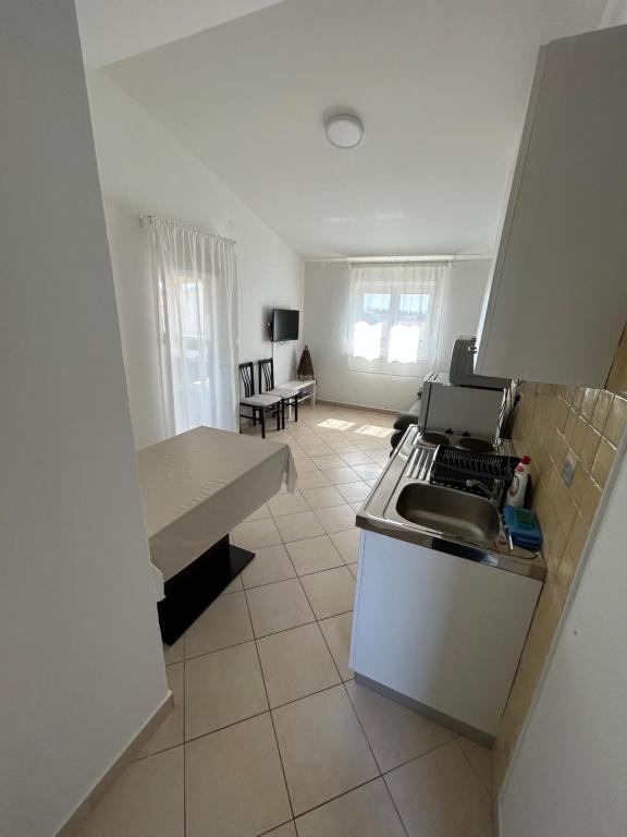 Kuchyňa alebo kuchynka v ubytovaní Apartments Duda