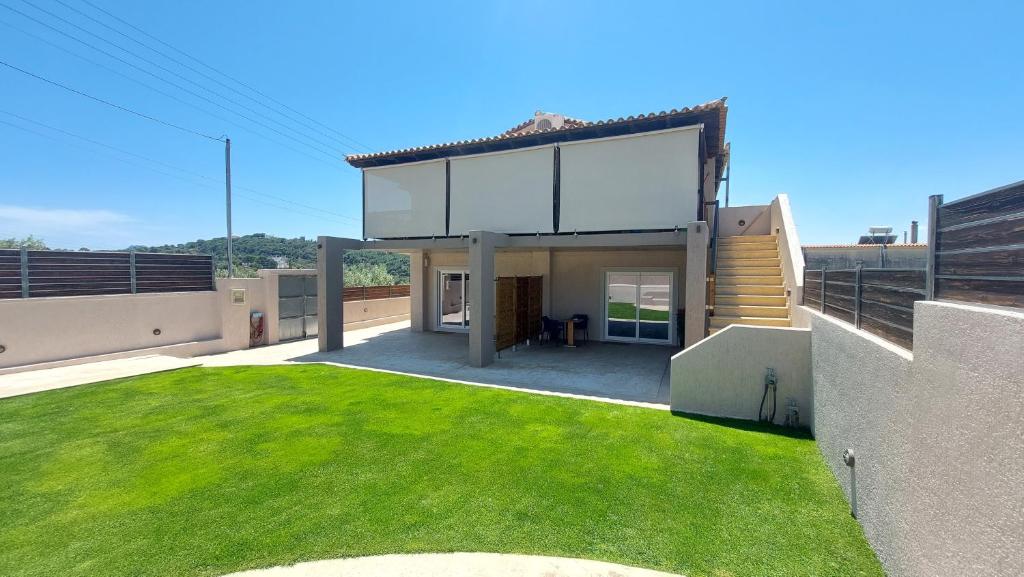 a house with a large window on the roof at Jimmy's place in Artemida