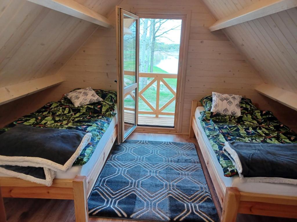 Postel nebo postele na pokoji v ubytování Ranczo Rykowisko
