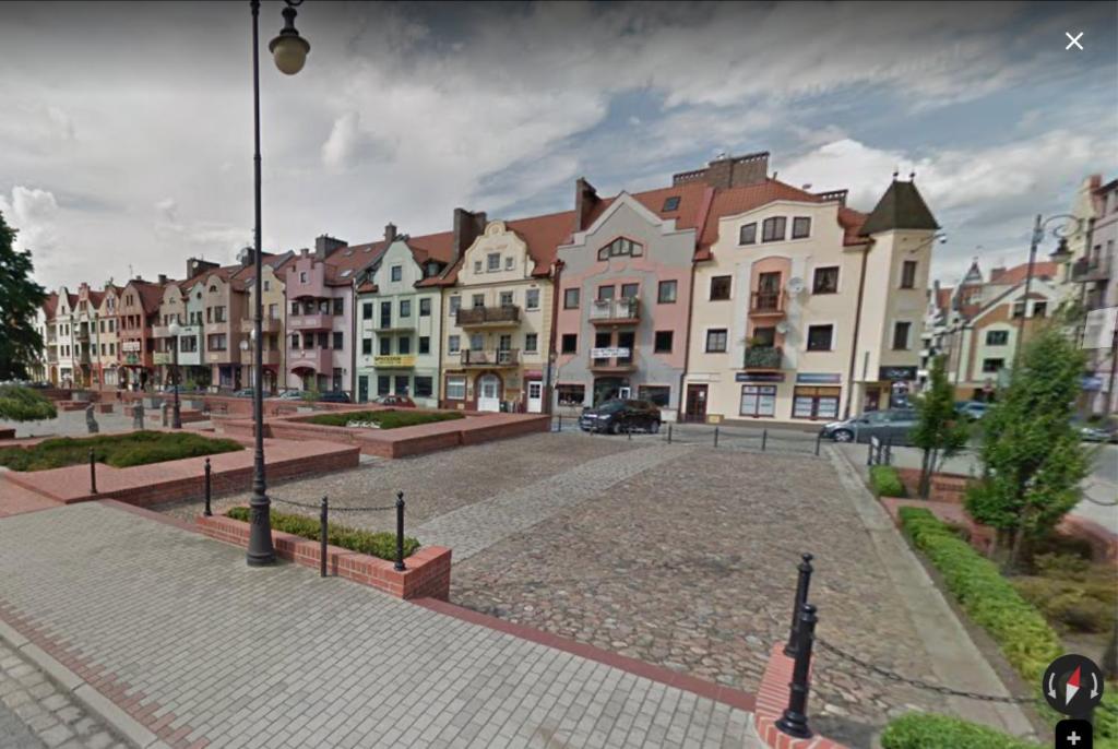 a city street with a bunch of buildings at City Single Wohnung in Głogów