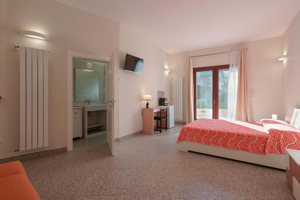 Postel nebo postele na pokoji v ubytování Le tre zie B&B