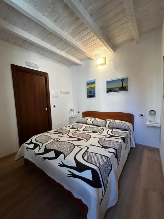 a bedroom with a large bed in a room at Borgo degli Svevi rooms in Bari