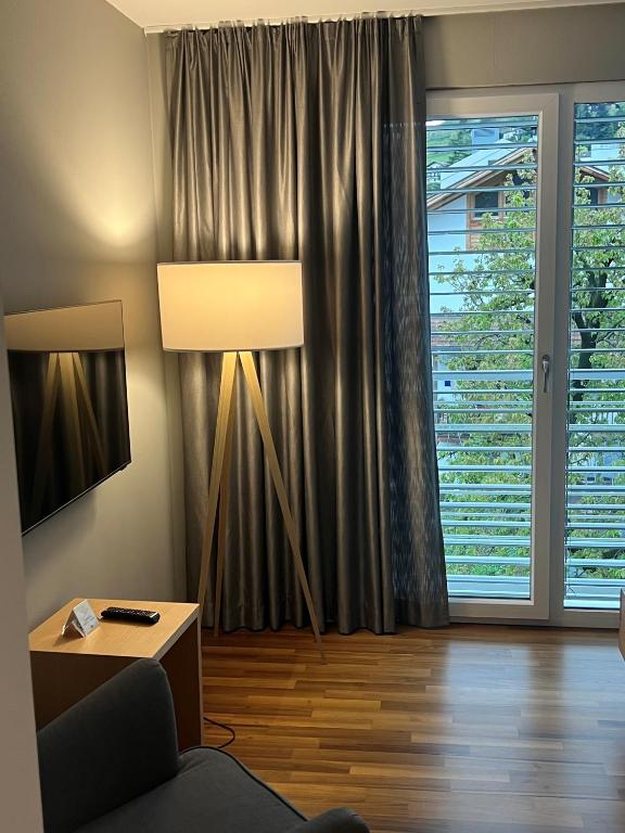 TV a/nebo společenská místnost v ubytování Hotel Jardis