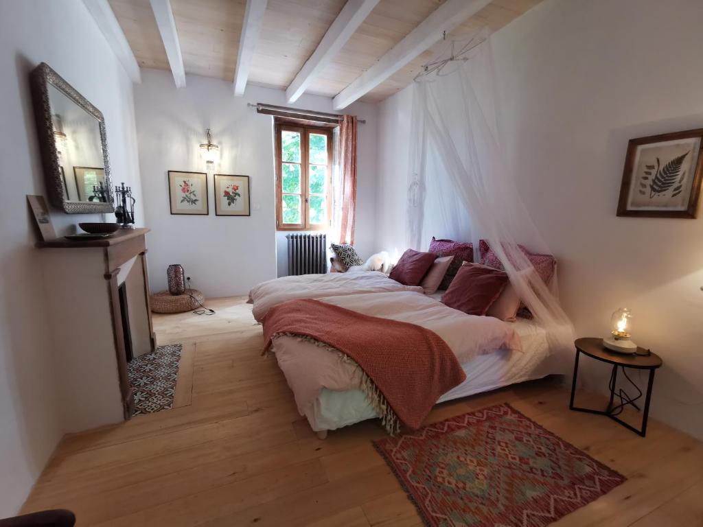 Postel nebo postele na pokoji v ubytování Mas d’Aubrac