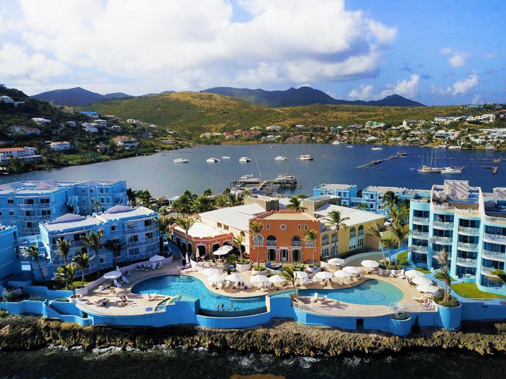 an aerial view of a resort with a marina at Oyster Bay Beach Resort in Dawn Beach