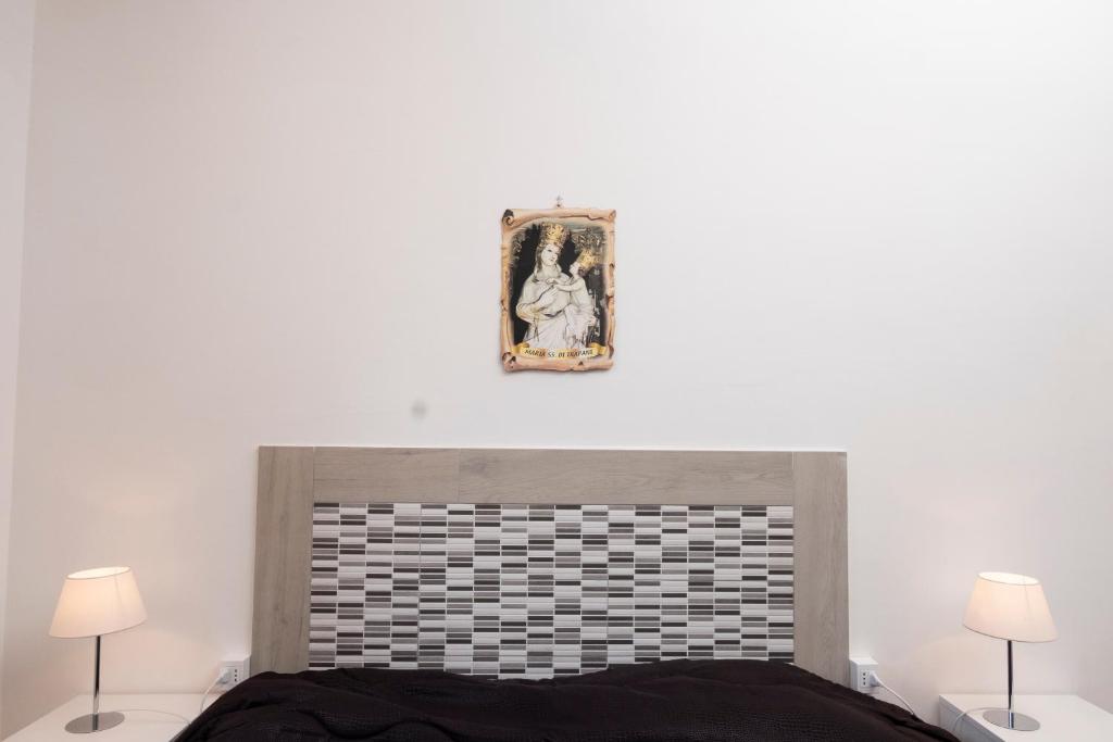 Łóżko lub łóżka w pokoju w obiekcie Casa Laura di fronte la Tonnara