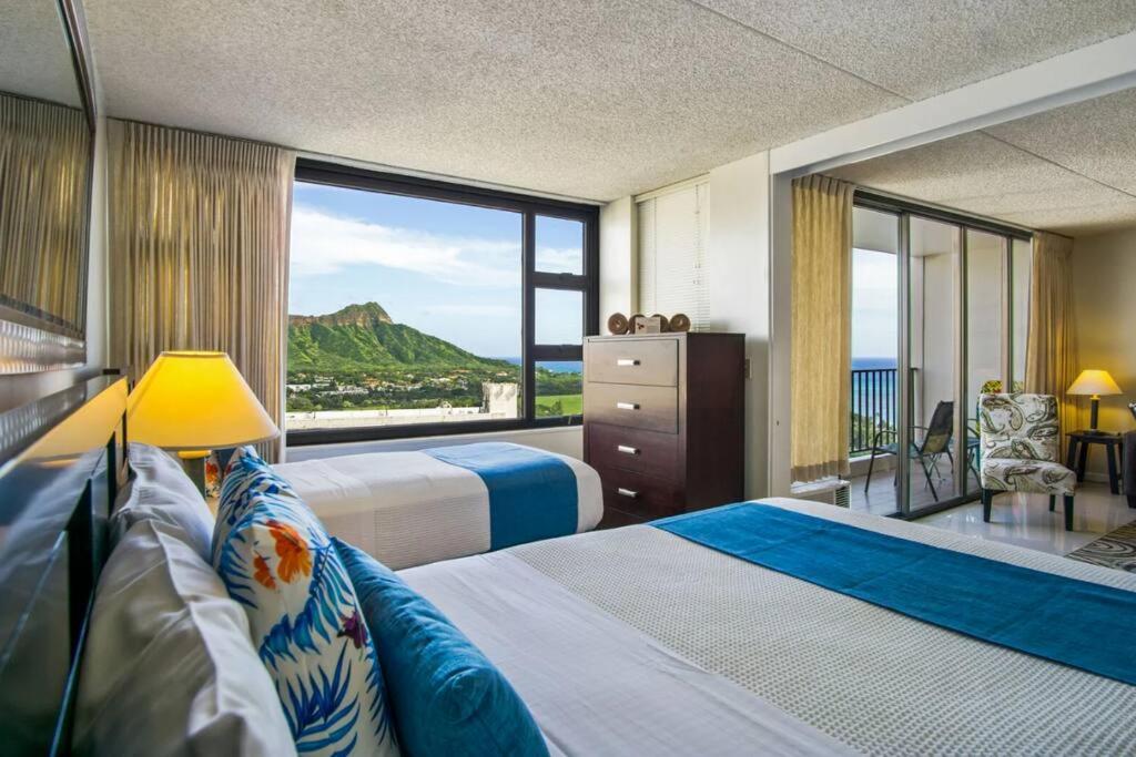 a hotel room with two beds and a large window at Lë'ahi Diamond Head Suite 1 Bedroom 1 Free Parking in Honolulu