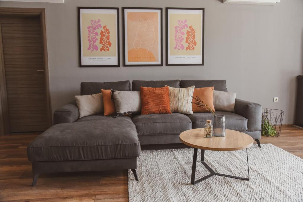 a living room with a couch and a table at Apartment Andrija in Šibenik