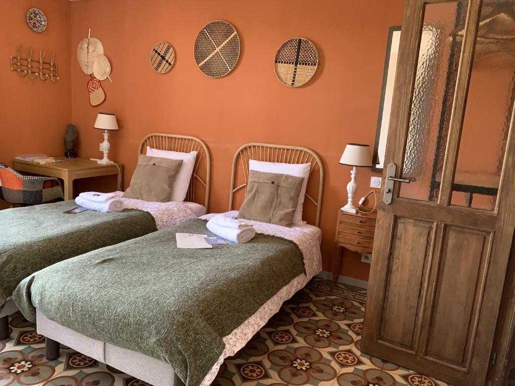 Postel nebo postele na pokoji v ubytování Chambre d'Hôtes Lo Componaïro