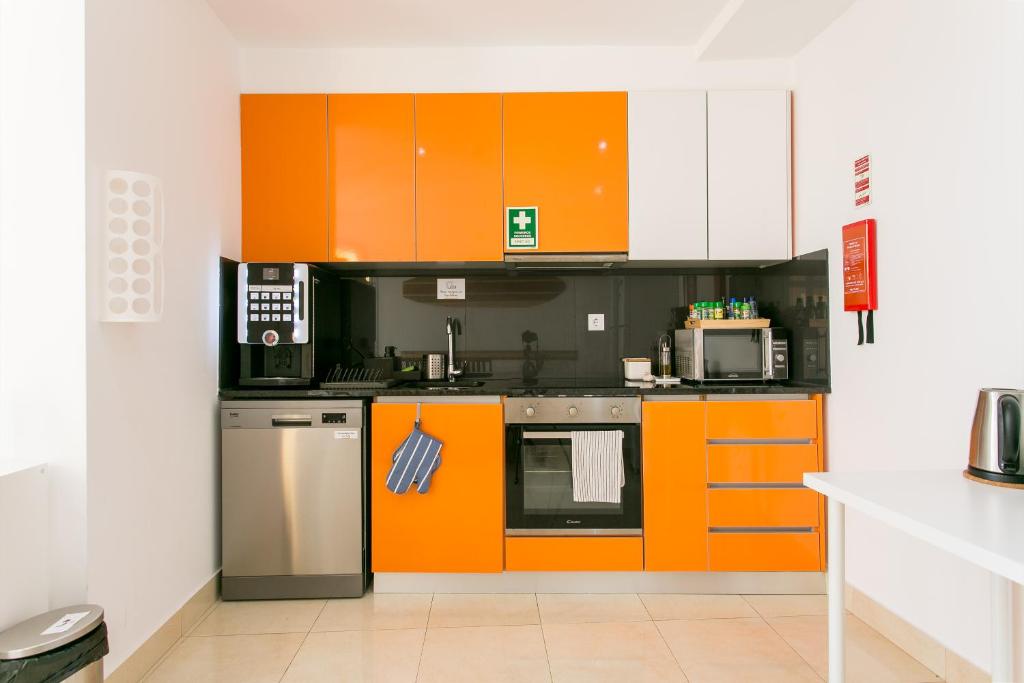Kuchyň nebo kuchyňský kout v ubytování Casa Amarela Guesthouse