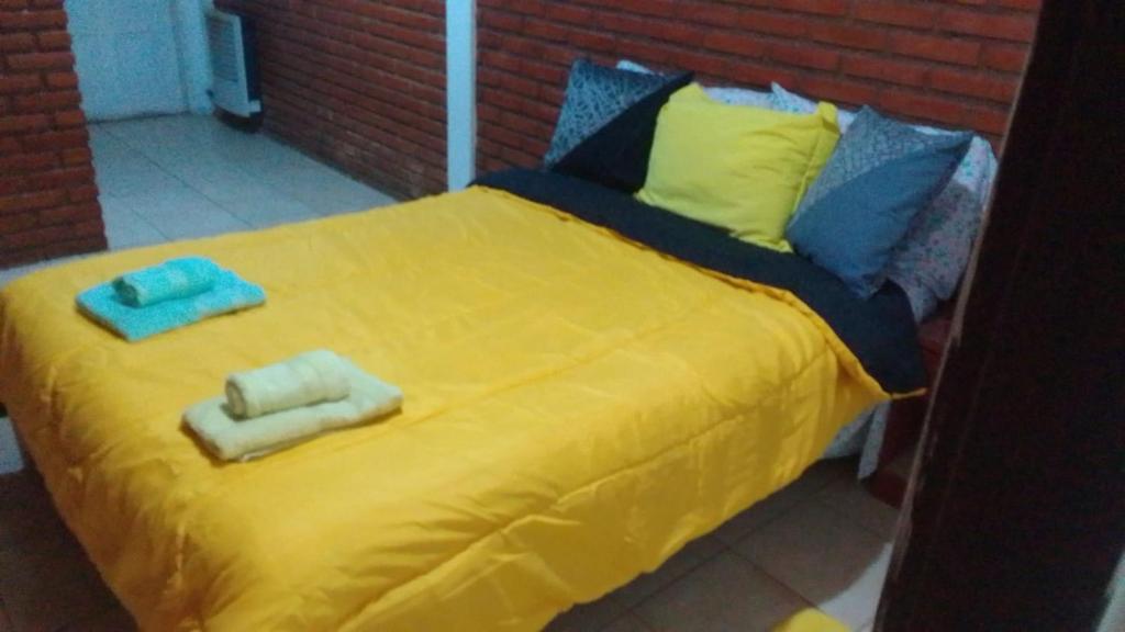Una cama o camas en una habitación de Apartamento en San Luis