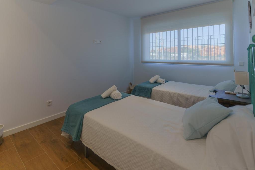 Posteľ alebo postele v izbe v ubytovaní Casa Bluebelle Guadalmina