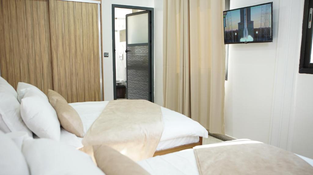 Säng eller sängar i ett rum på Hotel Riad Taounate