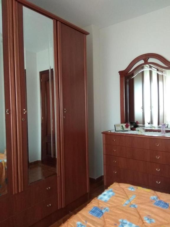 Postel nebo postele na pokoji v ubytování EnSAN CIPRIÁN Faro de Punta Atalaya